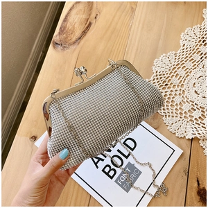 Close-up of sparkling silver rhinestone evening clutch with elegant kiss-lock closure