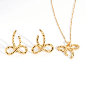 Detailed set of 18K gold butterfly necklace and earrings with twisted rope texture