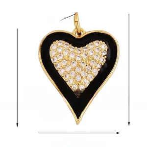 Macro detail of heart charm with micro-paved zircons and black enamel trim