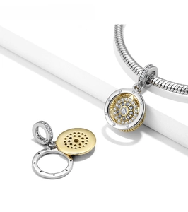 Detailed close-up of S925 sterling silver evil eye pendant with gold accents and zircon stones