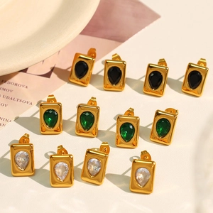 Elegant 18K gold-plated earrings with emerald green and black teardrop-shaped gemstones