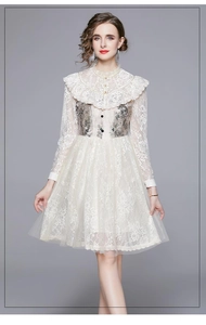 Detail of white lace long sleeves with floral embroidery on a vintage French dress