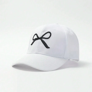 White cotton baseball cap featuring black 3D bow embroidery for outdoor sun protection