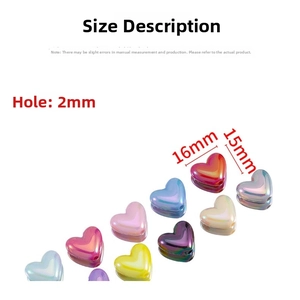 Macro detail of 16mm colorful acrylic heart beads with 2mm holes for DIY jewelry