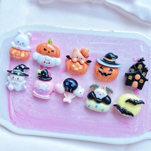 Detailed view of ten assorted resin Halloween charms including pumpkins and ghosts