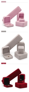 Detailed set of velvet jewelry boxes in pink, grey, and burgundy for rings and necklaces