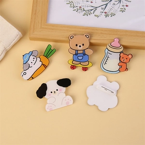 Set of cute cartoon acrylic bear pins and animal brooches for bags on yellow background
