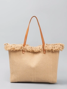 Minimalist beige woven tote bag with fringe trim and brown leather handles for women