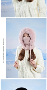 Detail of pink knitted winter balaclava with faux fur trim and integrated neck warmer