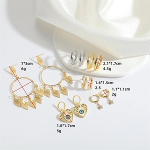 Golden evil eye heart and pearl earrings set shown with size and weight dimensions