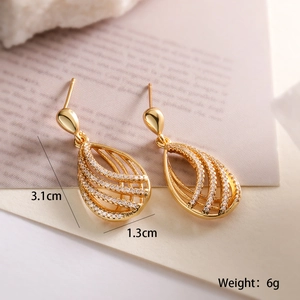 Detail view of gold-plated teardrop earrings with dimensions 3.1cm and 6g weight