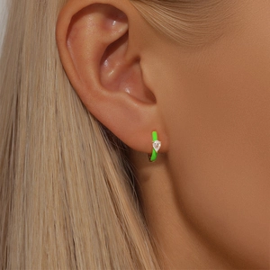 Close-up of S925 silver neon green enamel butterfly earrings with a pear-cut zircon