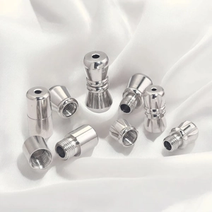 Polished silver stainless steel screw clasps for jewelry necklaces on white silk background