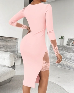 Detail of pink bodycon dress featuring delicate lace panels and a stylish side slit
