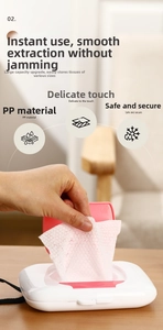 Close-up of portable wet wipe box with pink flip lid showing smooth tissue extraction