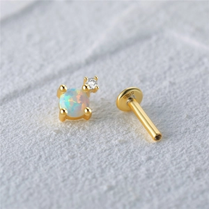 Detailed macro view of S925 sterling silver opal flat back stud earring with gold plating