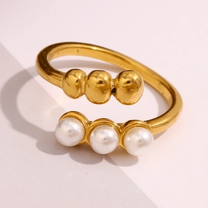 Detailed macro view of 18K gold plated beaded open ring with three white pearls