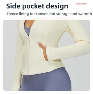 Detail of soft cream fleece zip-up jacket showing side pockets and thermal inner lining