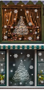 Detail showing white Christmas tree and snowflake window stickers in a cozy home setting