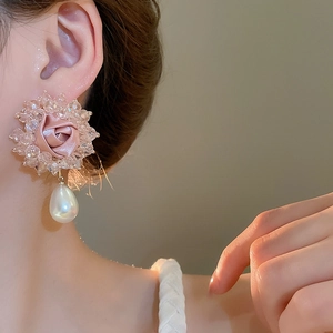 Detail of pink fabric rose earring with crystal beads and teardrop pearl pendant