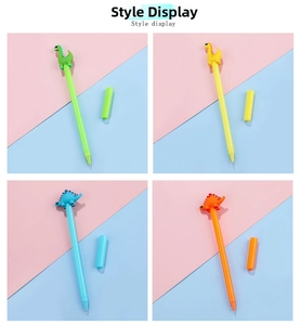 Detail view of four colorful cartoon dinosaur gel pens in green, blue, yellow, and orange