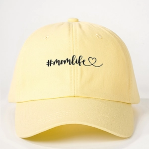 Adjustable cream cotton baseball cap with embroidered #momlife and heart design