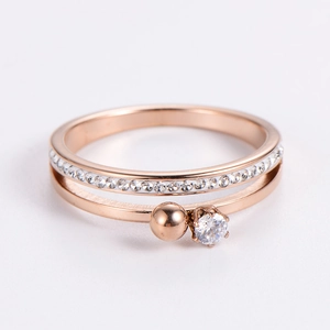Detail shot of a rose gold double-layer ring with sparkling zircon and pave setting
