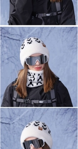 Close-up of winter knit beanie and neck warmer set with snowflake jacquard patterns
