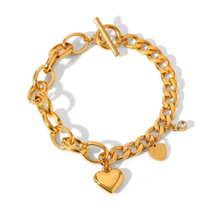 Detail of gold-plated OT clasp bracelet with heart charms and small crystal stone