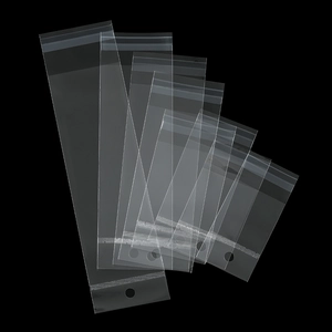 Macro detail of various sized transparent laser OPP self-sealing bags with hanging holes
