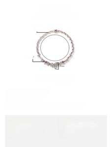 Close-up of hip hop thorn necklace with red eye stones and cubic zirconia details