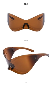 Detail view of tea-colored Y2K futuristic sunglasses showing positive and side perspectives