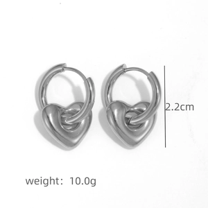 Detail view of heart pendant earrings in silver finish with 2.2cm height and 10g weight