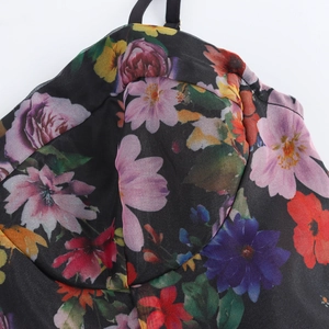 Elegant black organza dress with colorful floral print and slim shoulder straps