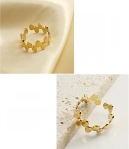 Macro detail of 18k gold plated stainless steel irregular oval link ring
