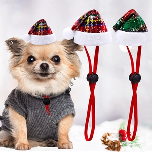 Detail of pet Christmas hat with adjustable elastic strap and festive plaid pattern