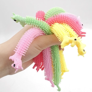 Hand holding colorful unicorn sensory stretch strings in soft macaron TPR textures