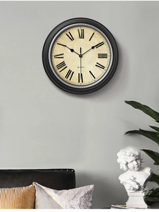 Retro Nordic wall clock on gray wall with modern living room decor and sofa