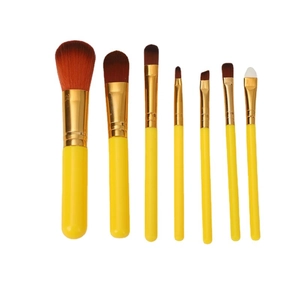 7Pcs portable yellow makeup brush set with gold ferrules and colorful bristles