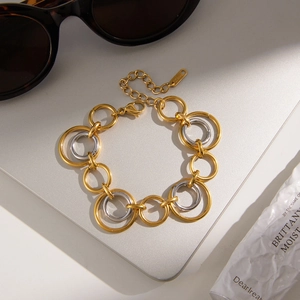 Two-tone gold and silver stainless steel chain bracelet with interlocking rings design