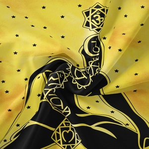 Detailed macro view showing the texture of Bohemian yellow tapestry with Om and star symbols