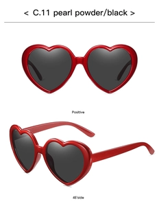 Front and 45-degree side views of heart-shaped sunglasses in pearl red with black lenses