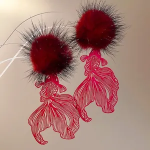 Hollow carp fish pendant earrings with dark red fur ball in elegant Chinese style