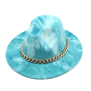 Detailed close-up of sky blue tie-dye fedora hat with decorative thick gold metal chain