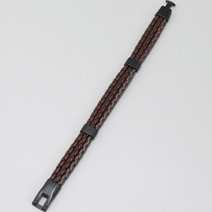 Detailed close-up of brown multi-layer braided leather bracelet with black metal buckle