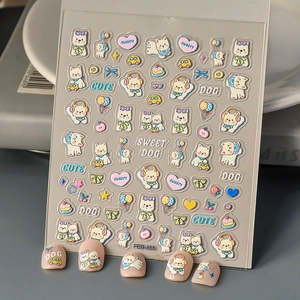 Detail of 3D embossed nail stickers featuring cute cream puppy, balloon and cake designs
