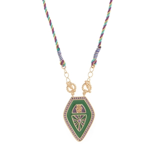 Detail of shield-shaped Hamsa pendant with green enamel and purple stone inlays on gold chain