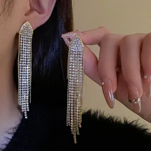 Elegant gold-plated silver needle tassel earrings with shimmering zircon fringe clusters