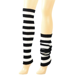 Close-up of black and white striped knitted leg warmers in stacked and straight style