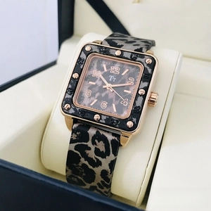 Close-up of leopard print square watch with rose gold case and blue gift box